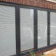 integral blinds viewed in a four pane bi-fold door
