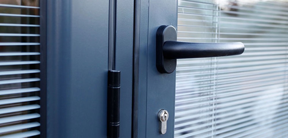 integral blinds in a grey bi-fold door