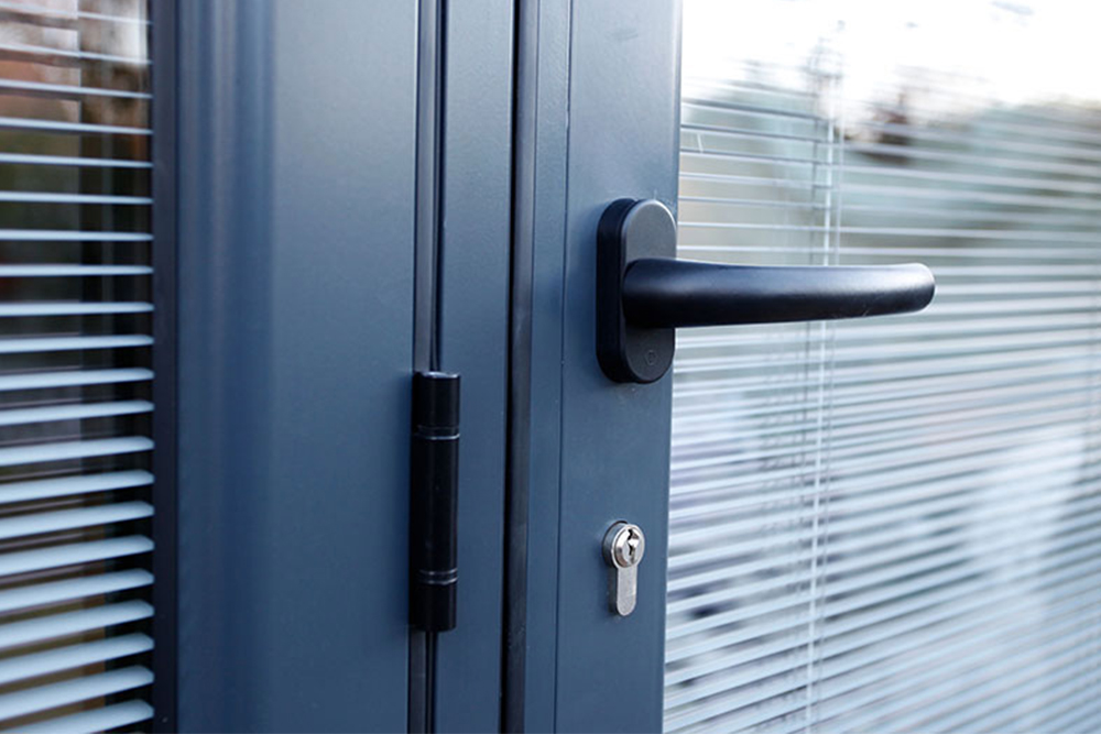 integral blinds in a grey bi-fold door