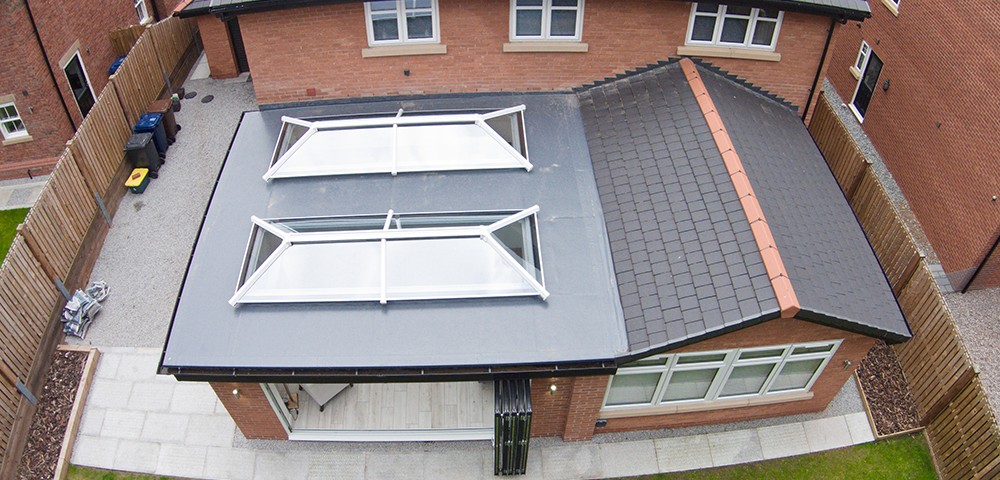 two roof lanterns on a flat roof