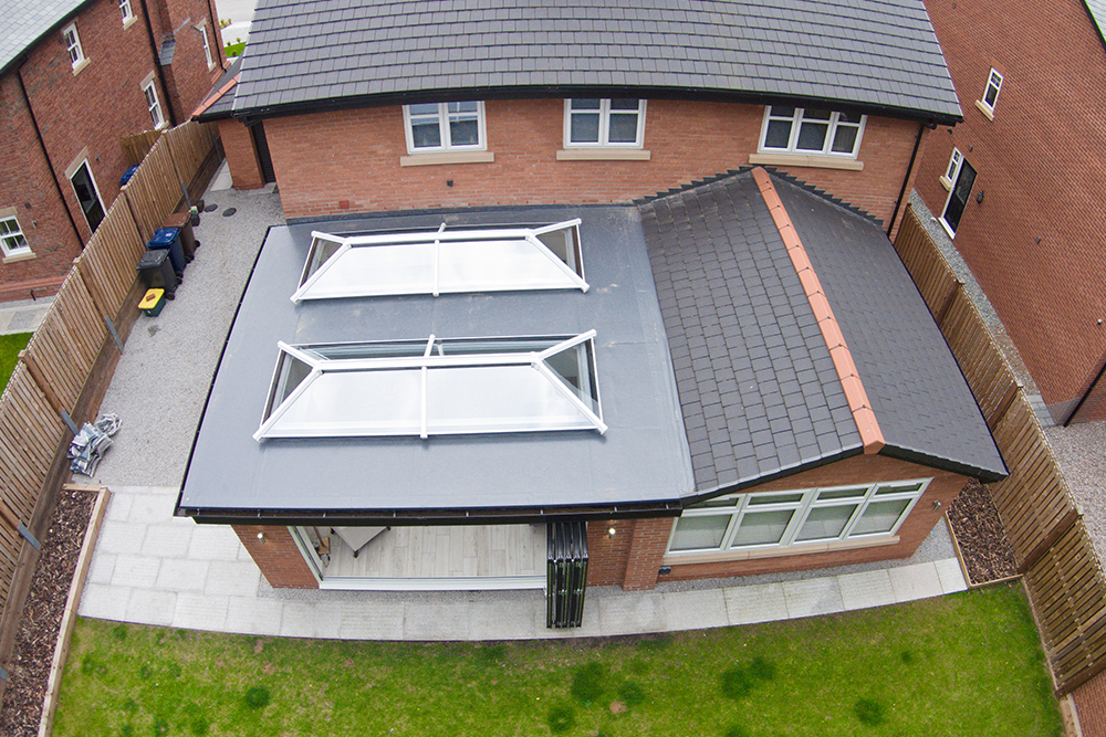 two roof lanterns on a flat roof
