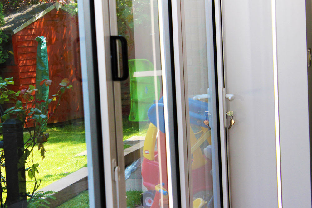 White queniborogh bi-fold door viewed close up from inside